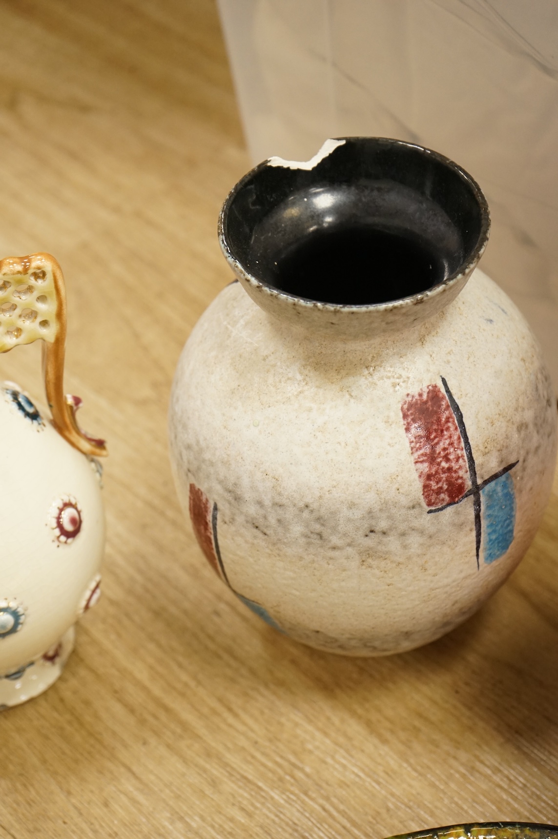 A collection of studio ceramics and pottery to include a Zsolnay vase and a Lyn Alves hexagonal dish